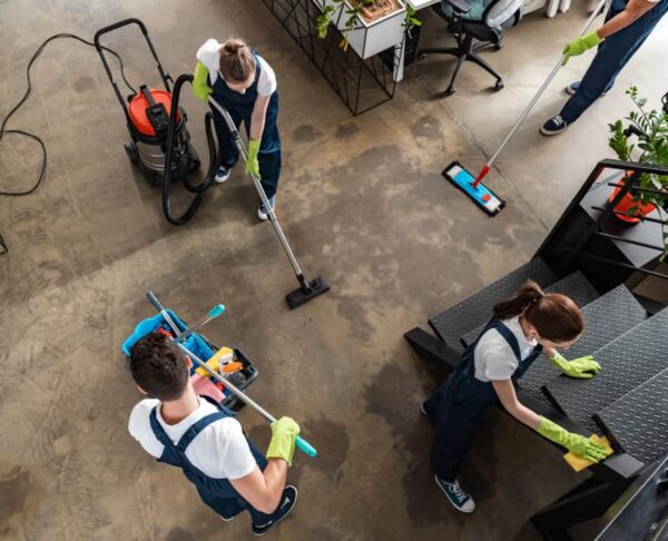 Top-Down-View-of-Several-Day-Porters-Cleaning-Office-Space-845x684
